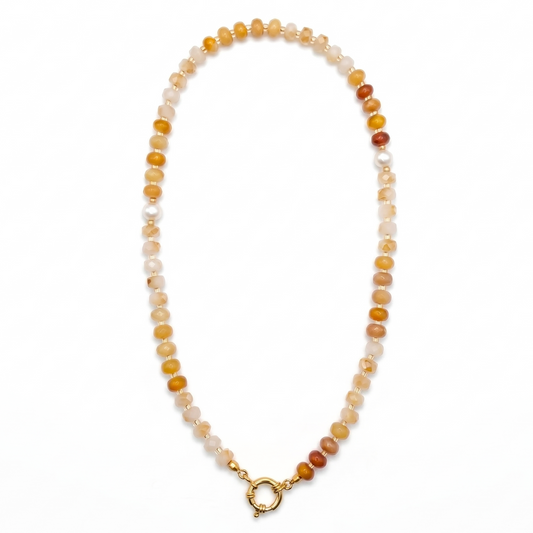 Beaded necklace with a gold clasp on a white background